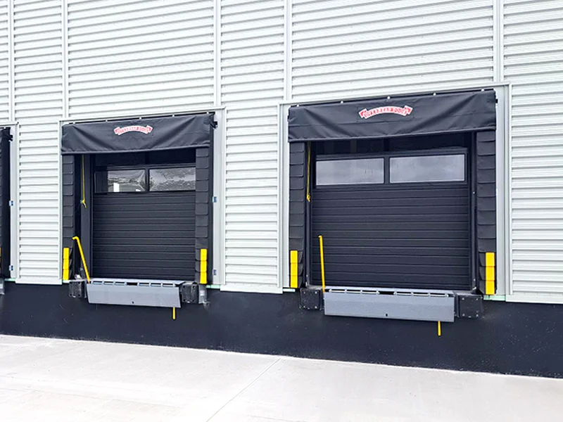 Dock equipment featuring two loading dock seals with overhead doors, designed for safe and efficient loading operations in industrial facilities.