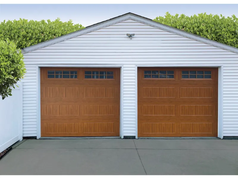 Thermacore Vertical Long Golden Oak garage doors installed on a residential garage, showcasing a modern and elegant design.