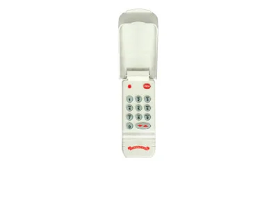 Keypad Model OWK-BX with open cover, featuring numeric buttons and a PROGRAM key, designed for garage door access solutions.